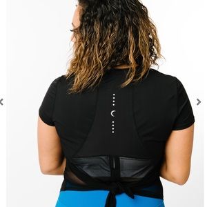Like New Zyia black panel split back tee.No longer available and not restocking!